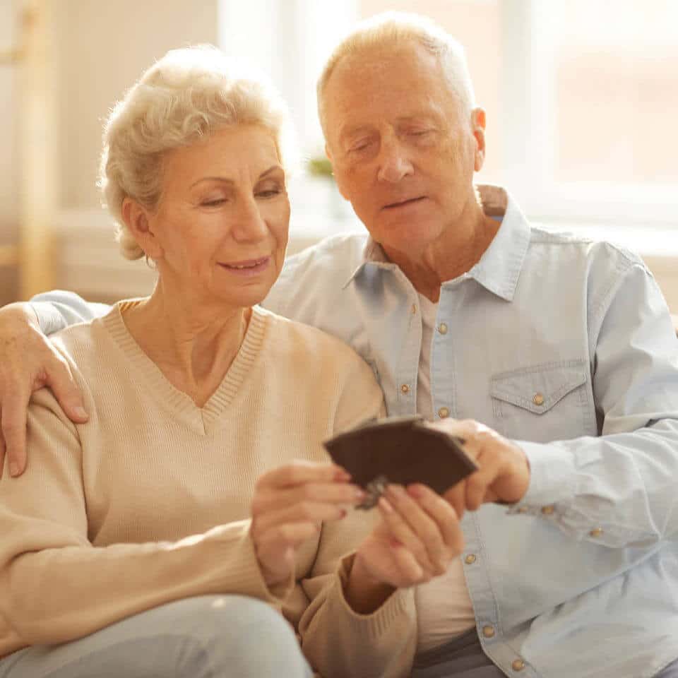 Senior couple looking at photos together.