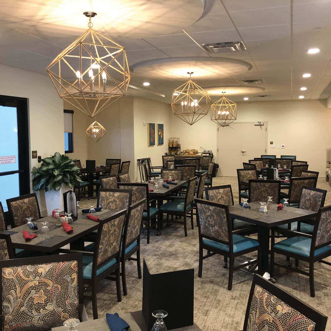 Dining Room with multiple tables and chairs.