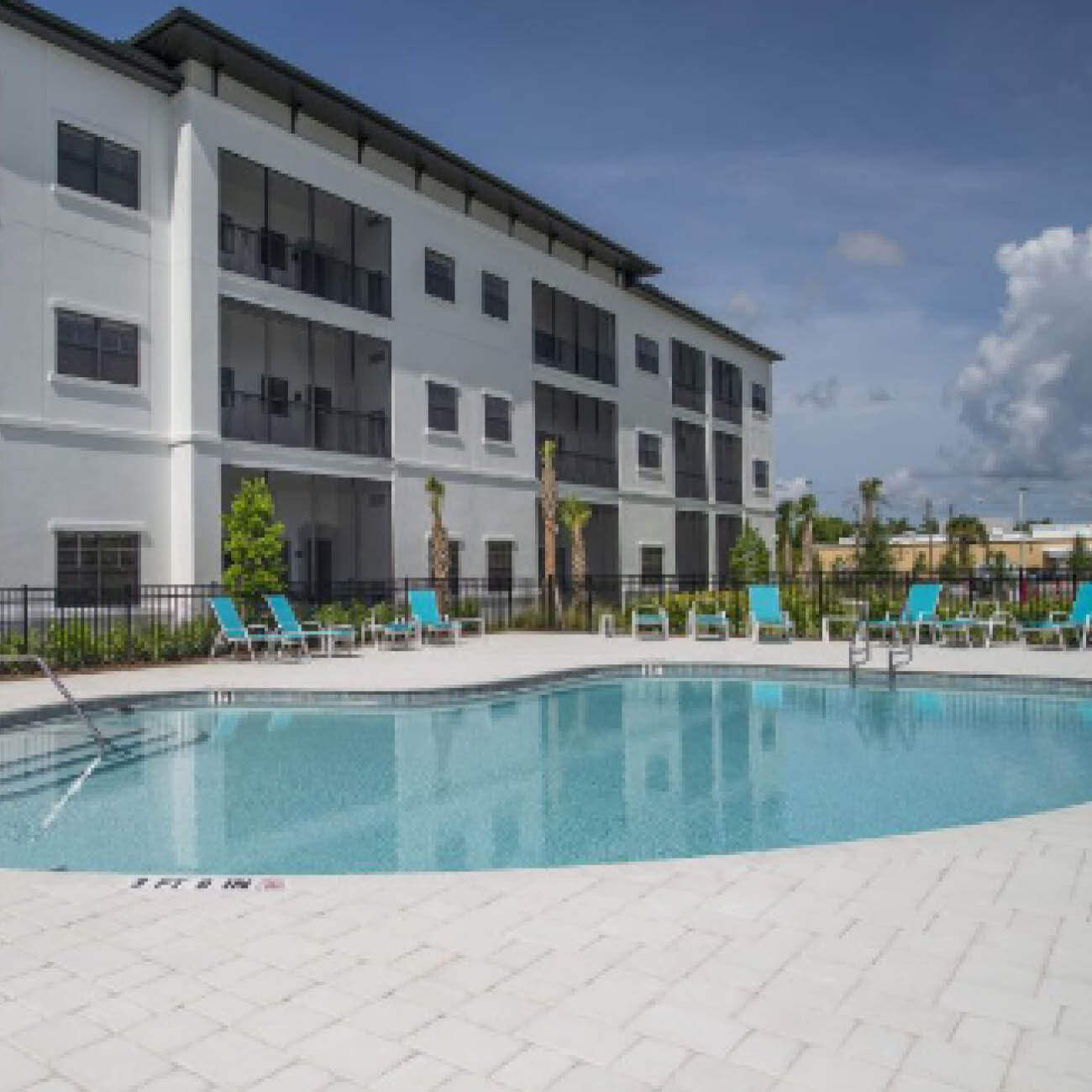 Pool, lawn chairs and balconies at Highpoint at Cape Coral